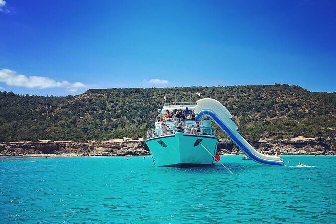 Blue Lagoon trip with slide & music departing from Latchi harbour - Aphrodite’s Baths: mythology views from the Akamas coastline