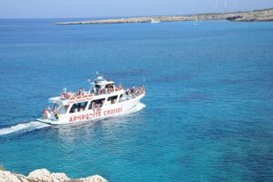 From Protaras: Turtle Cove & Blue Lagoon Cruise - The coast drive-by that turns into real context: Fig Tree Bay and Cape Greco