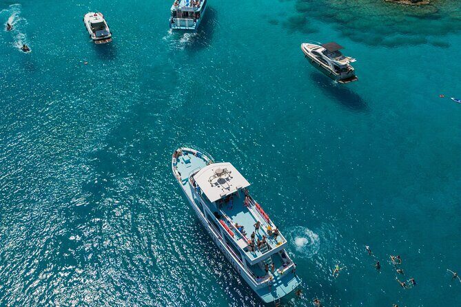 From Protaras: Turtle Cove & Blue Lagoon Cruise - Konnos Bay swim stop: golden sand, 30 minutes, and turtle-friendly rules